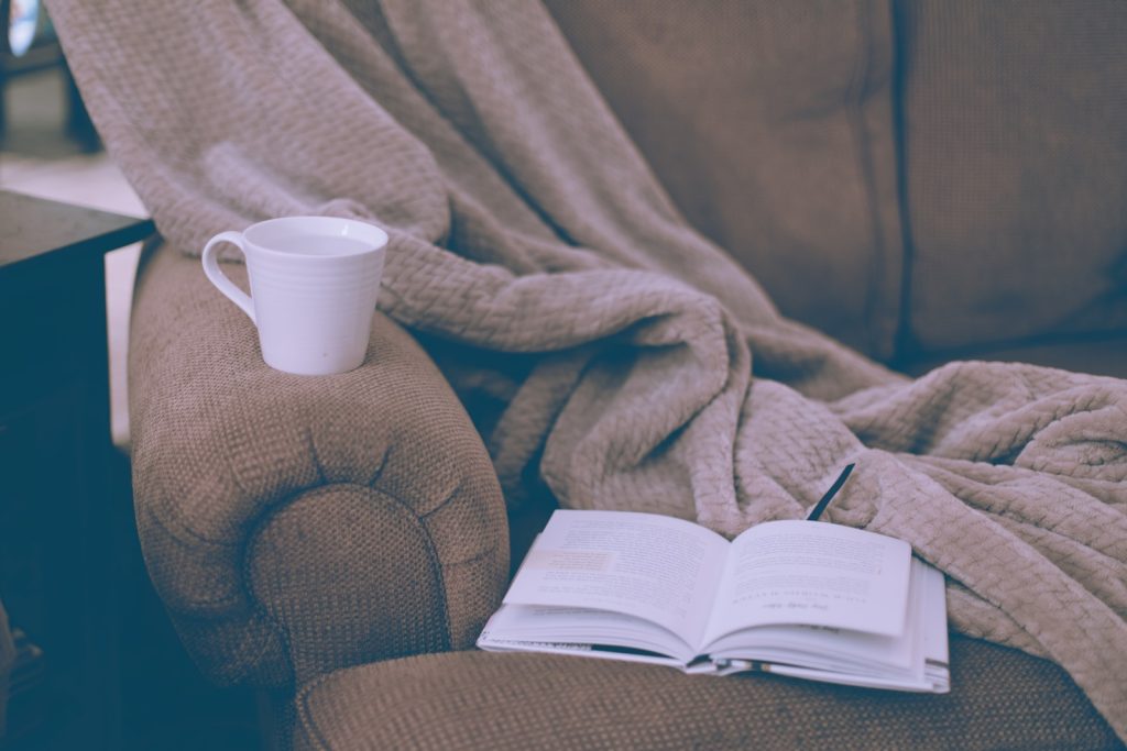 5 Ways to Make the Best of Your Days Off as a Nurse 3 white ceramic mug on book page