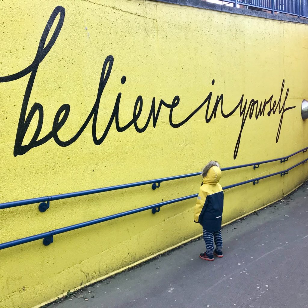 Positive Workday Affirmations for Nurses 6 toddler looking at believe in yourself graffiti