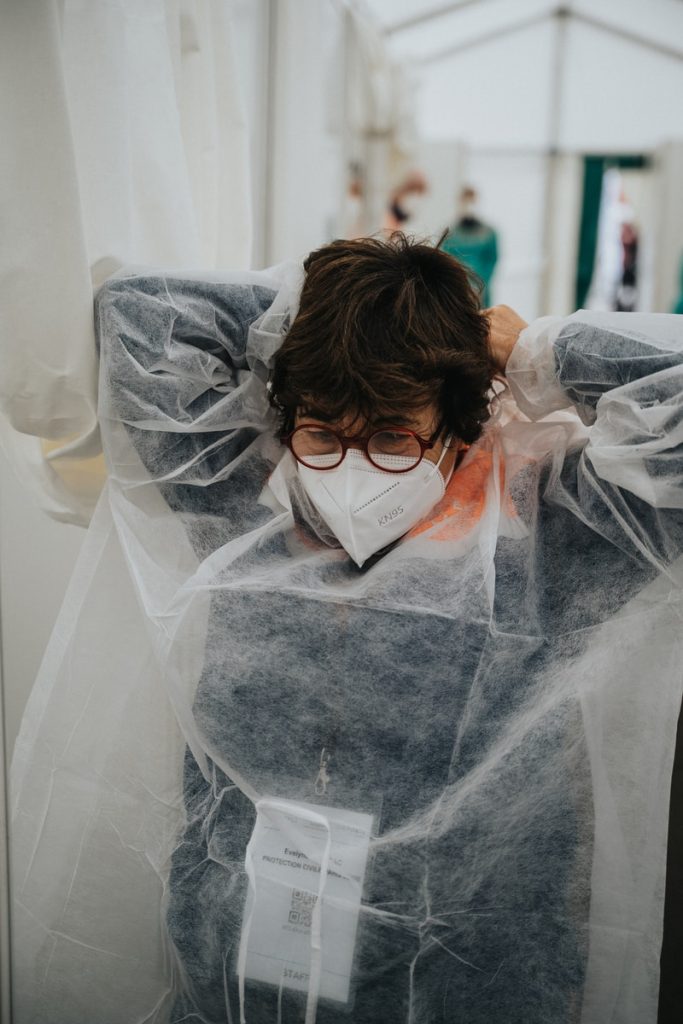 A Hospital to Home Ritual For Nurses 3 woman in white veil covering her face with white sheer textile